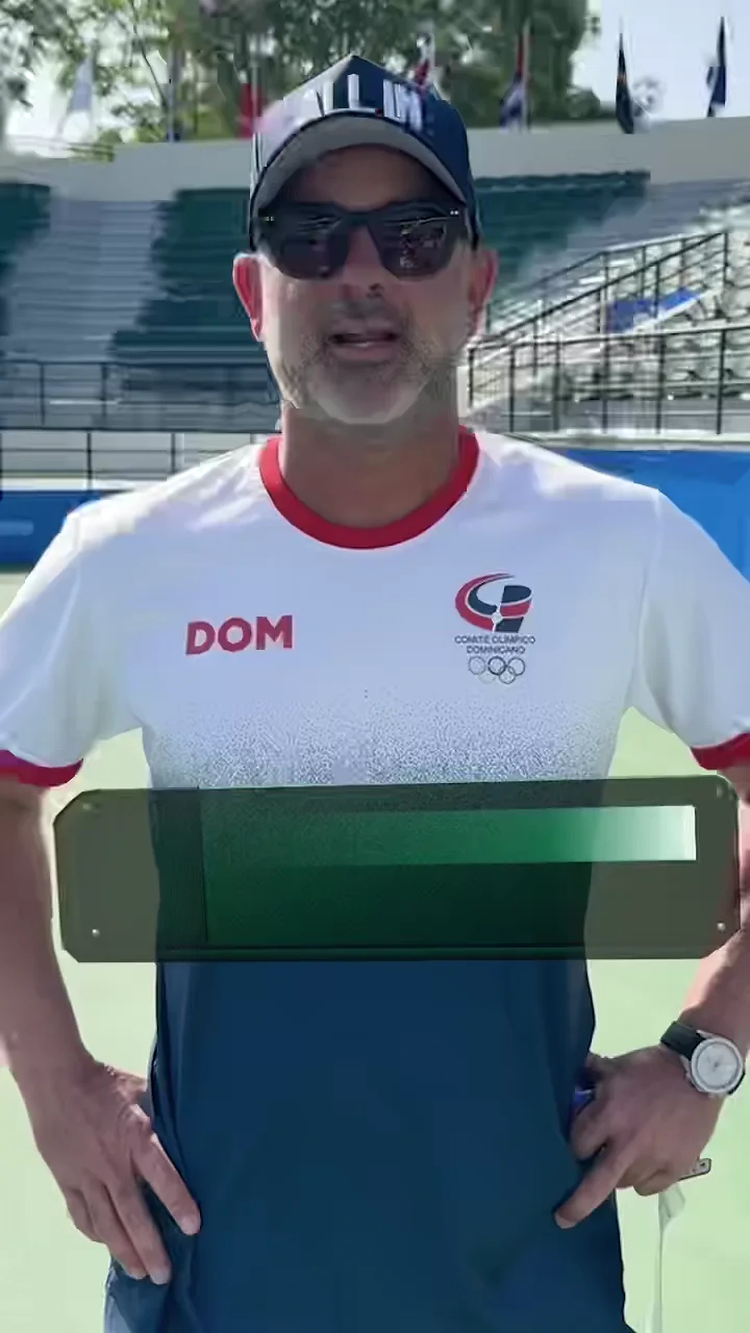 Jhonny speaking on a tennis court